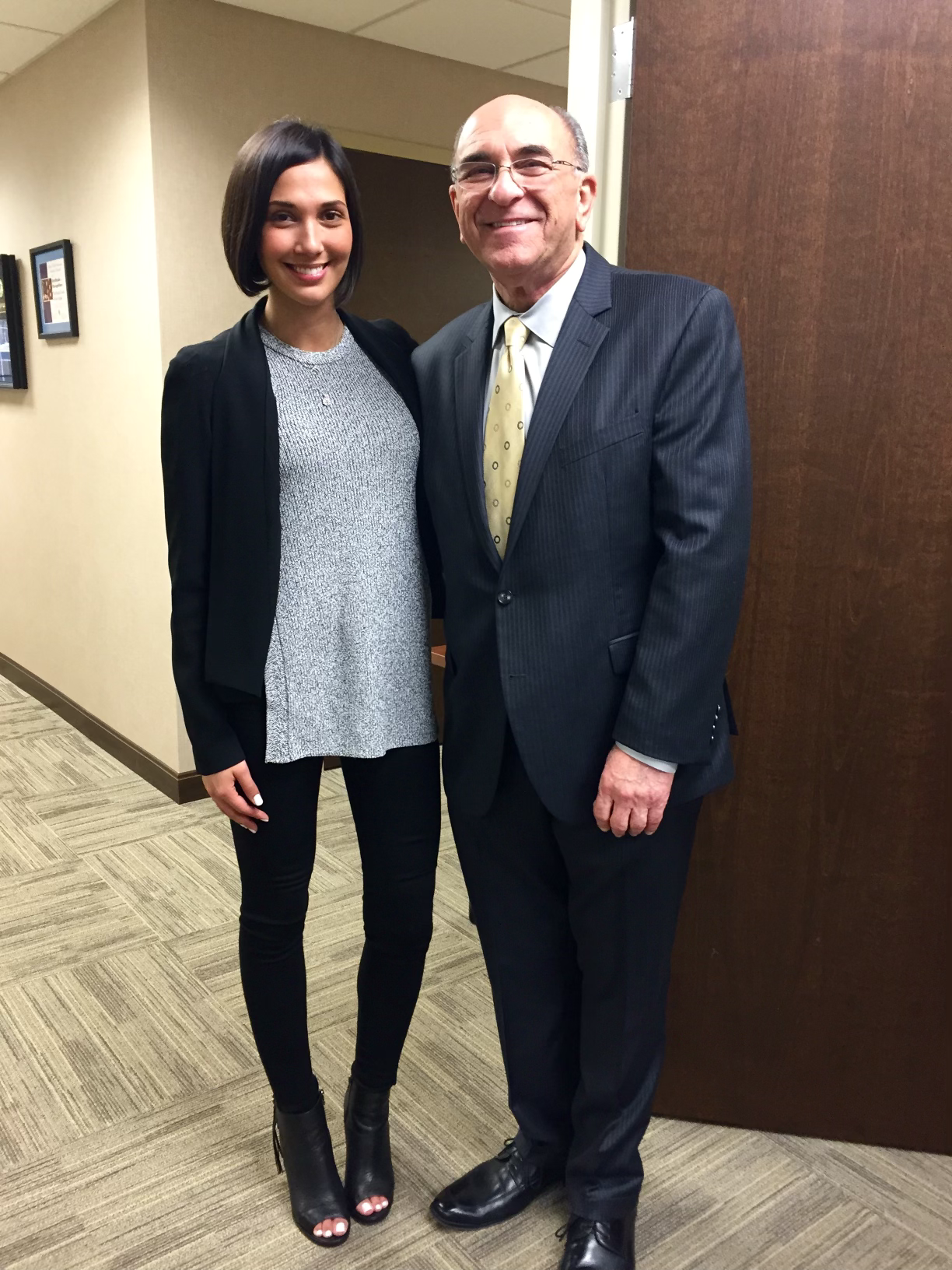 Original photograph of Feliza Castro with Representative Lou Lang after the hearing.