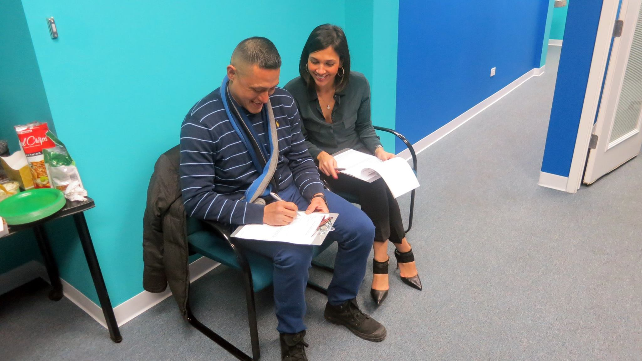 Feliza Castro helping Bobby Treviño prepare his medical cannabis petition during The Healing Clinic’s January 2015 event.